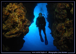 Caroline going down the Cheminee - Next to the Blue Hole ... by Michel Lonfat 